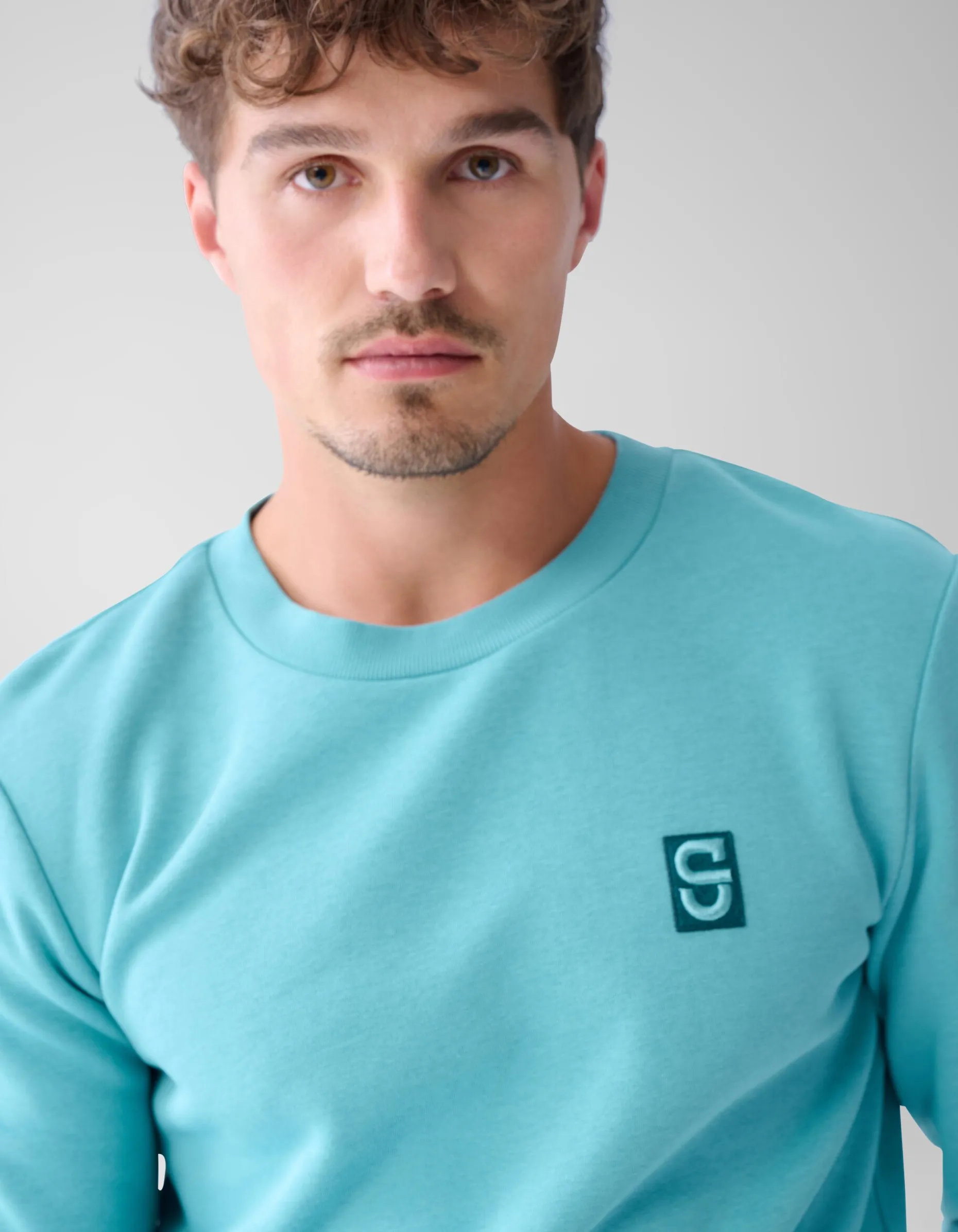 Badge Sweater Lichtgroen